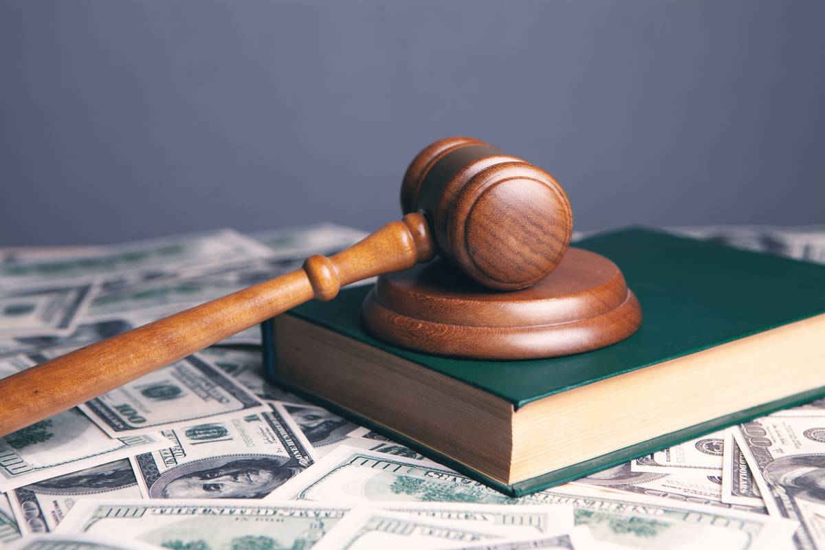 Court Fee Reimbursements paperwork on a desk with legal documents and calculator